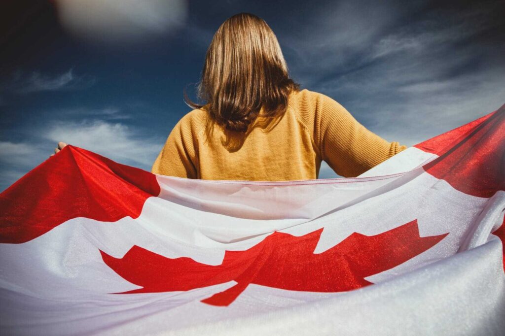 girl holding Canadian flag